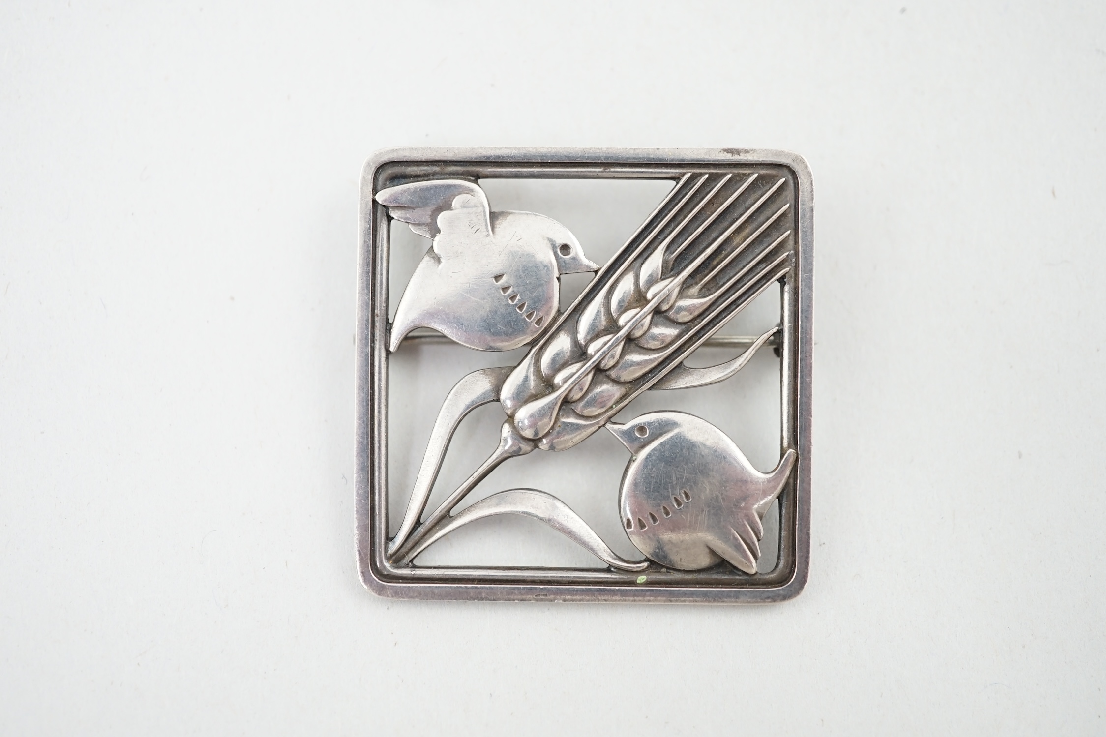 A Georg Jensen silver 'wheatsheaf and robin' brooch, design no. 250